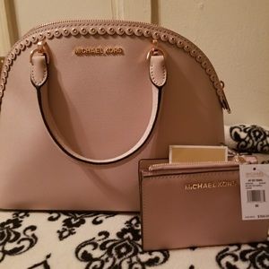 Brand new matching Michael Kors purse and wallet.